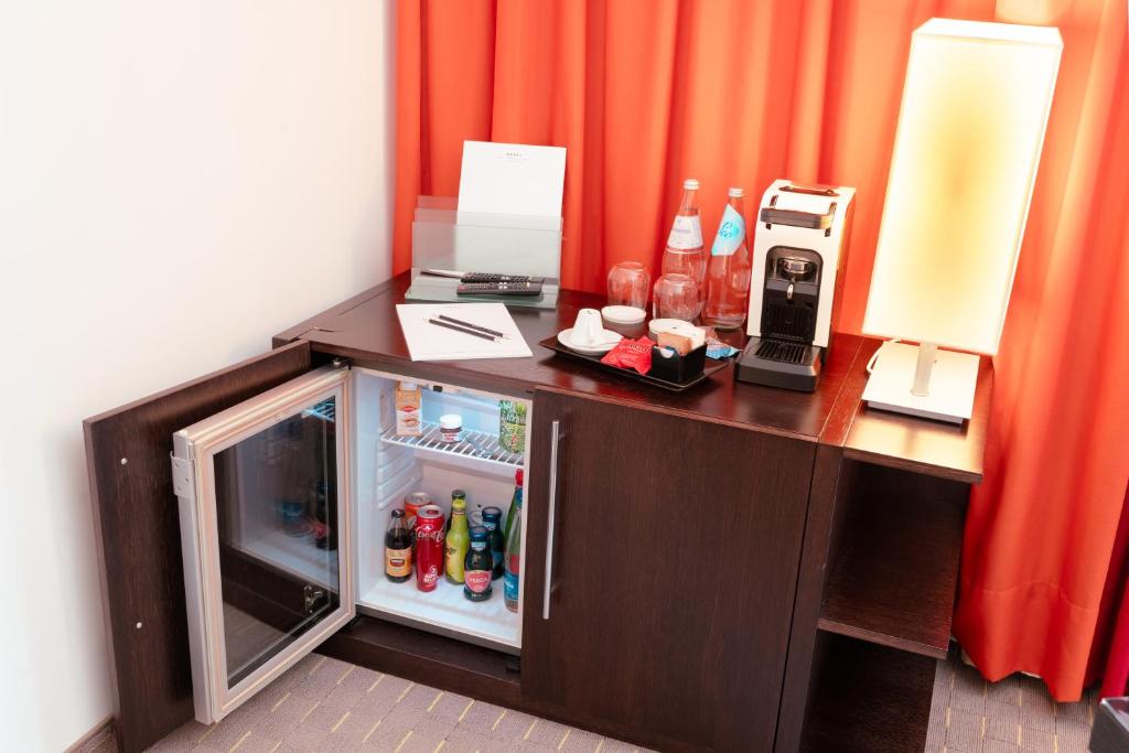Kuchyň nebo kuchyňský kout v ubytování Ariha Hotel Cosenza