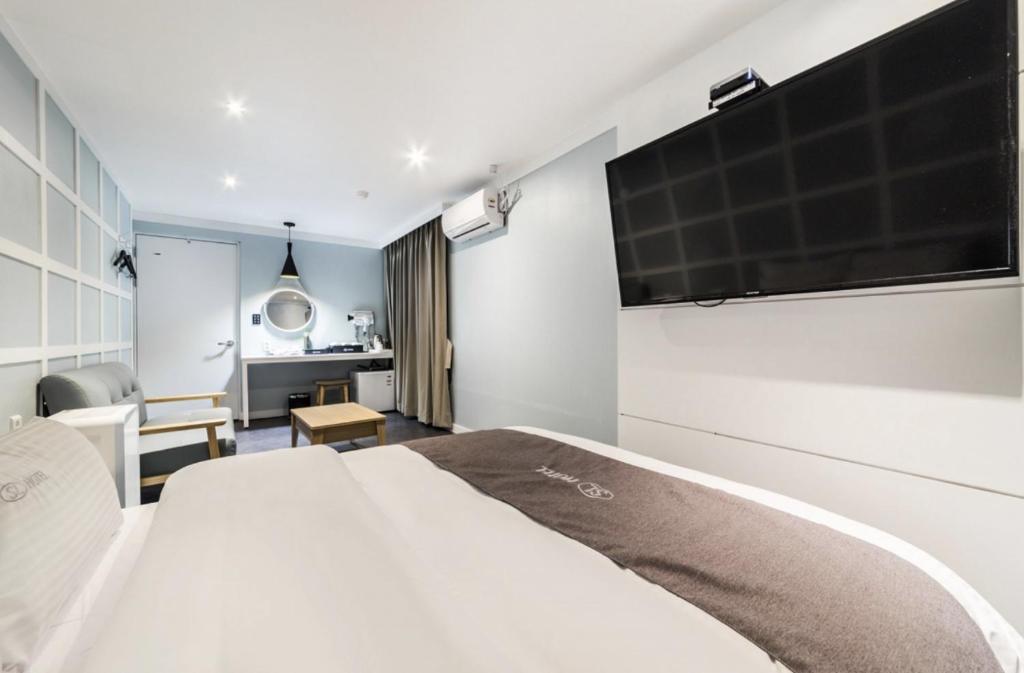 Postel nebo postele na pokoji v ubytování SL Hotel