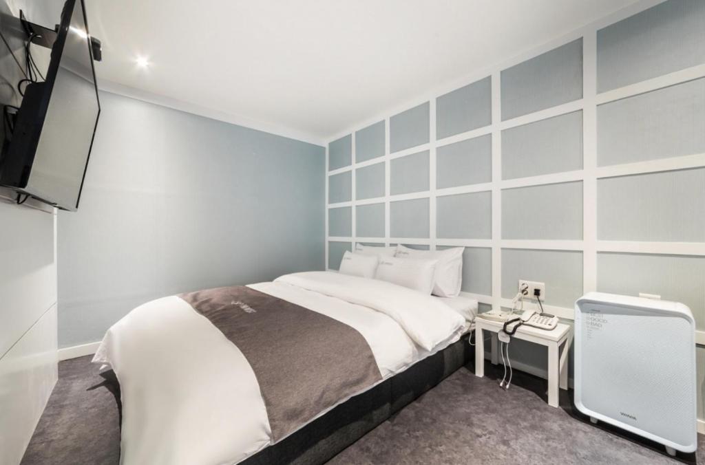 Postel nebo postele na pokoji v ubytování SL Hotel