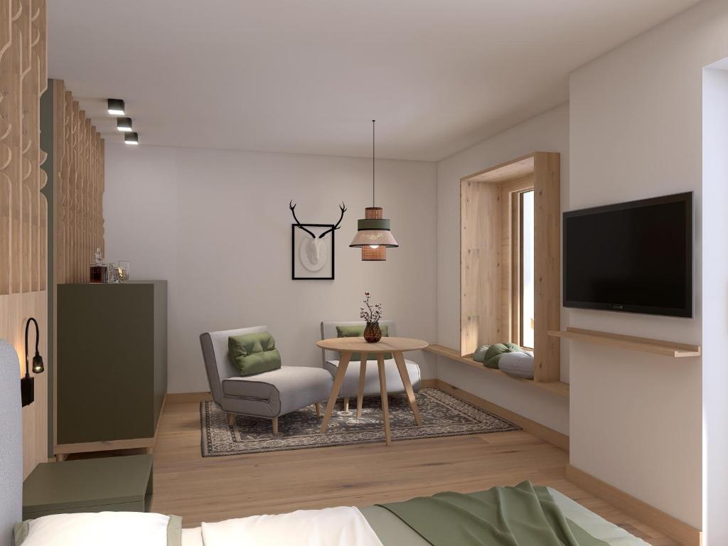 TV a/nebo společenská místnost v ubytování Stricker Aparthotel