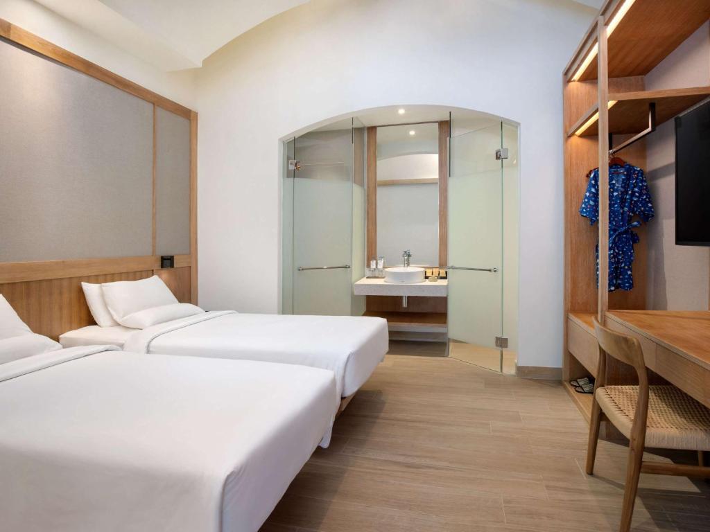 Postel nebo postele na pokoji v ubytování Novotel Bali Benoa