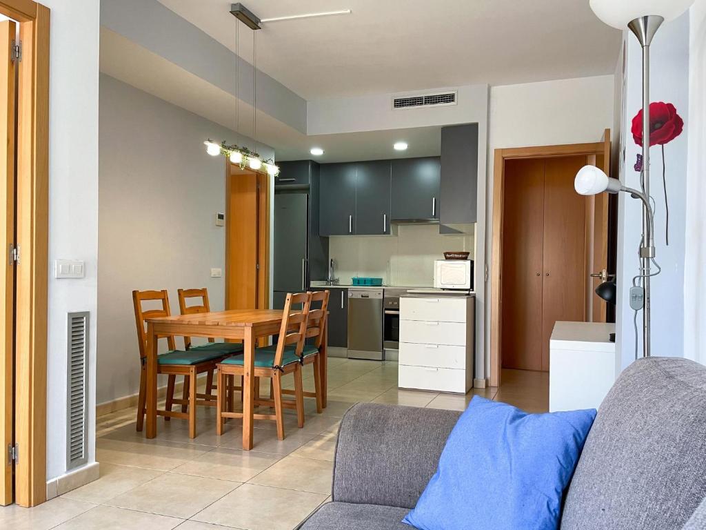 a kitchen and dining room with a table and chairs at Apartment Marina in Vilanova i la Geltrú
