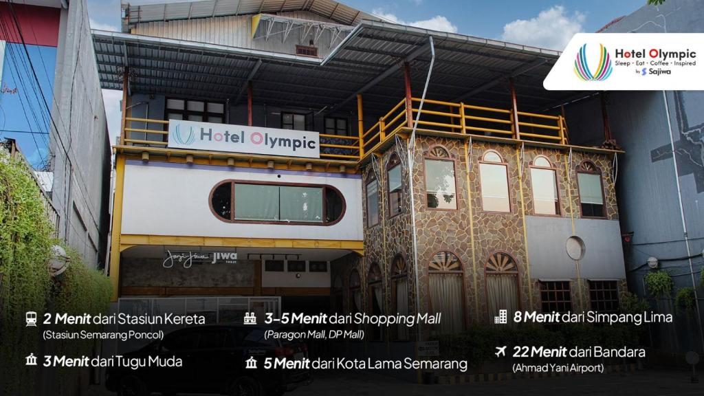 un edificio con un cartel en el costado en Hotel Olympic Semarang by Sajiwa, en Semarang