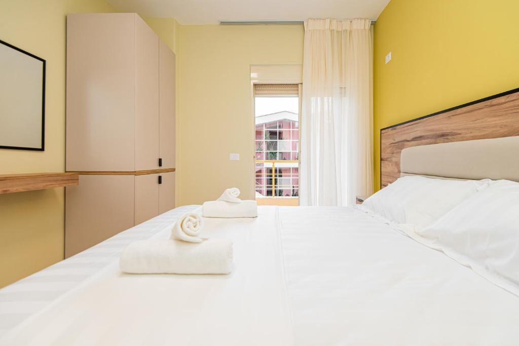 Postel nebo postele na pokoji v ubytování ApartHotel EDA