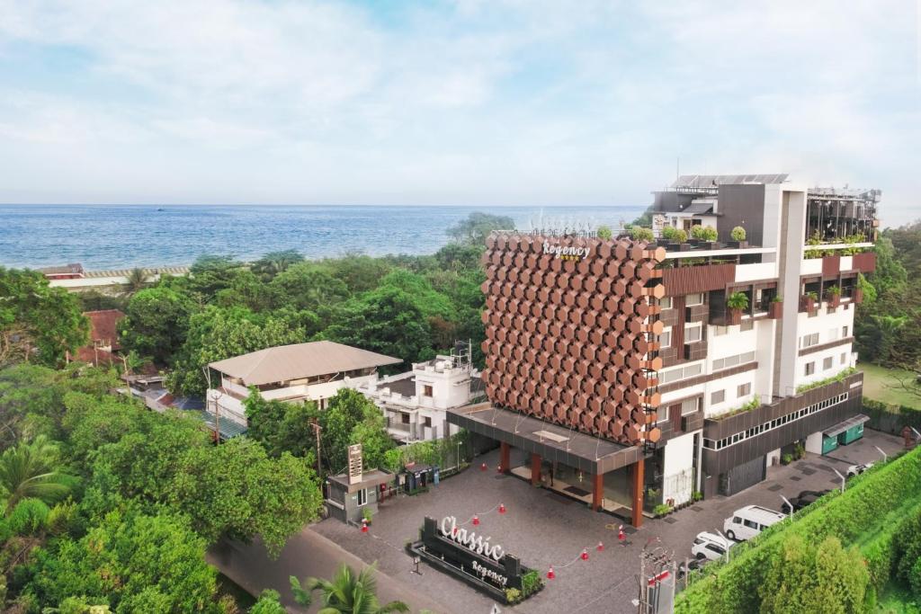 an overhead view of a building with the ocean in the background at Classic Regency in Alleppey