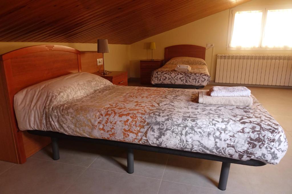 Posteľ alebo postele v izbe v ubytovaní apartament dúplex "Alsina"
