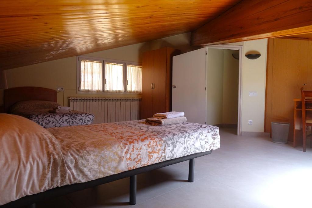 Posteľ alebo postele v izbe v ubytovaní apartament dúplex "Alsina"