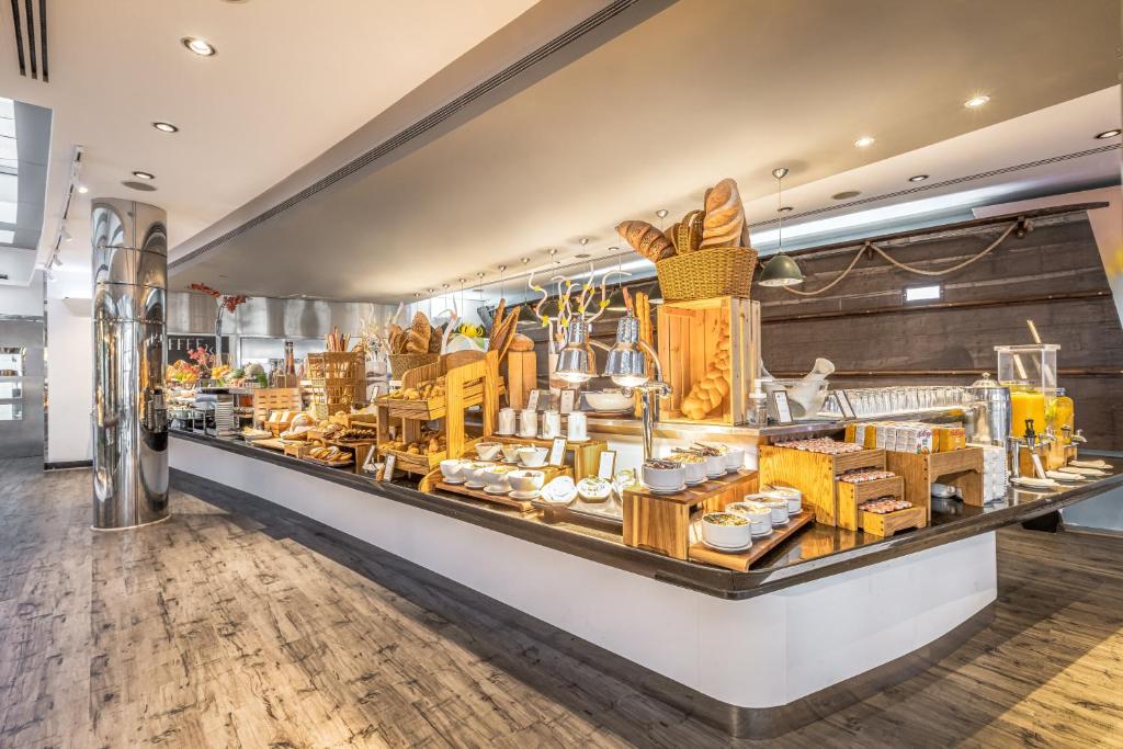 a display case in a store with a lot of food at Golden Sands Boutique Hotel-Dubai Creek in Dubai