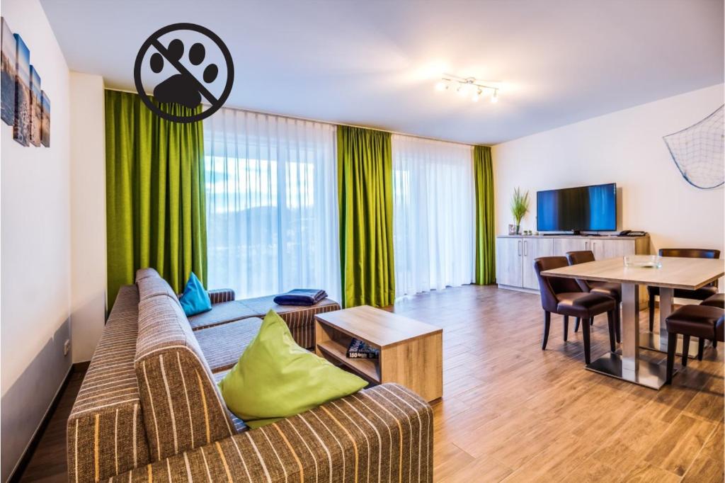 TV a/nebo společenská místnost v ubytování Lagovida Das Ferienresort Am Störmthaler See