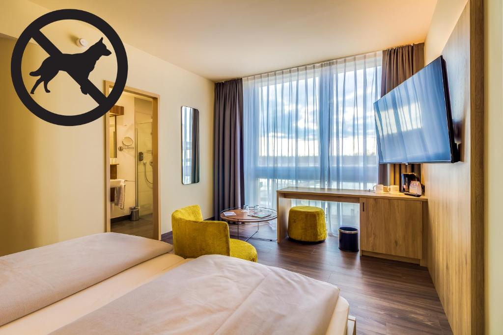 Postel nebo postele na pokoji v ubytování Lagovida Das Ferienresort Am Störmthaler See