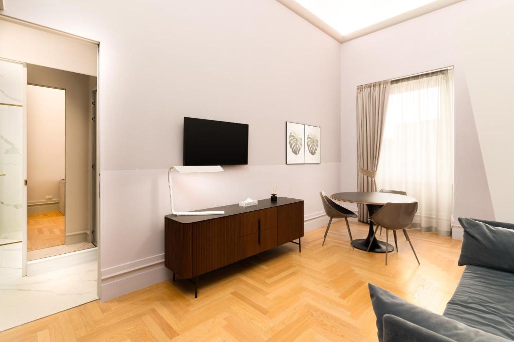 Televízia a/alebo spoločenská miestnosť v ubytovaní limehome Lecce Palazzo BN