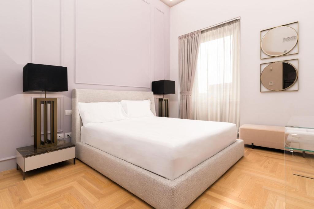 Posteľ alebo postele v izbe v ubytovaní limehome Lecce Palazzo BN