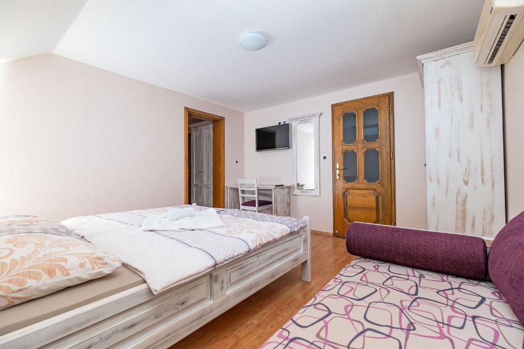 Postel nebo postele na pokoji v ubytování Zelena Oaza - B&B