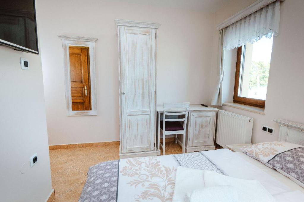 Postel nebo postele na pokoji v ubytování Zelena Oaza - B&B