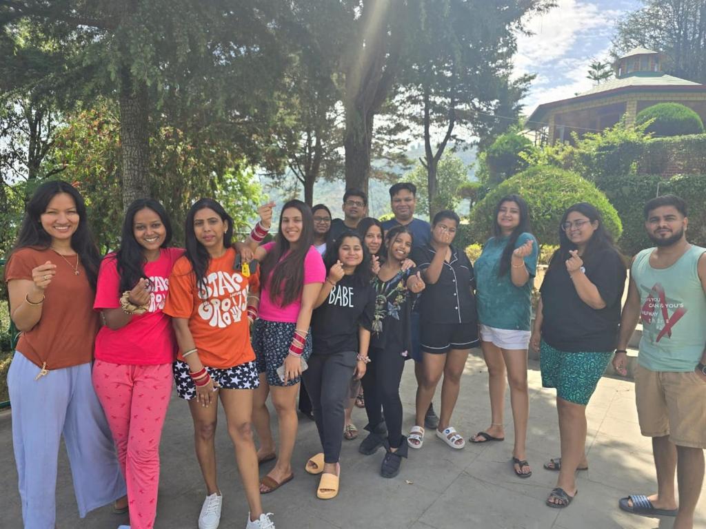 a group of people posing for a picture at The Himalaya Retreat Resort, Experience Nature in the Lap of Himalayas in Mussoorie