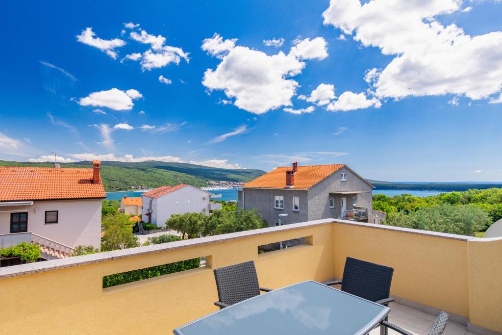 a view from the balcony of a house with a table and chairs at Diego in Kornić