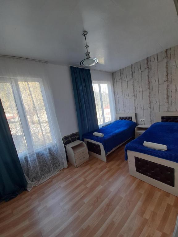 Postel nebo postele na pokoji v ubytování Guesthouse of Irina