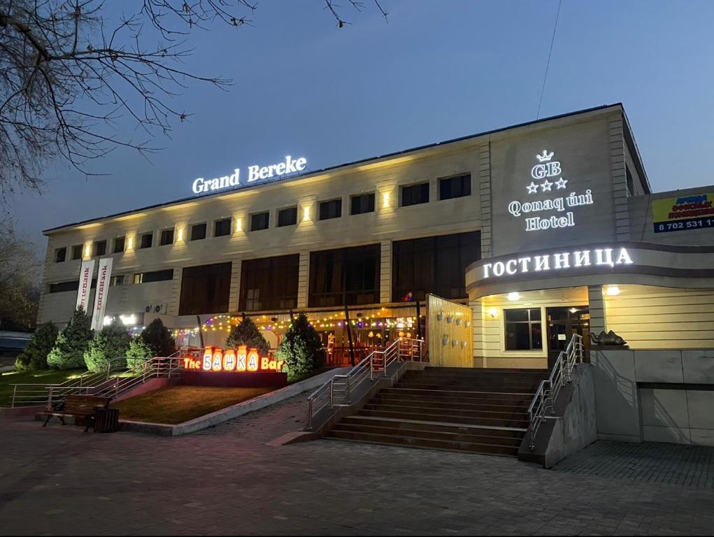 a building with stairs in front of a restaurant at Grand Bereke Hotel in Almaty