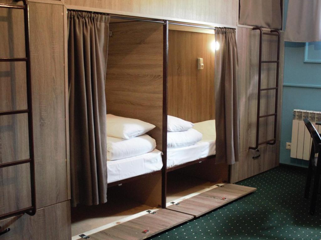 Letto o letti in una camera di All Eyes Hostel