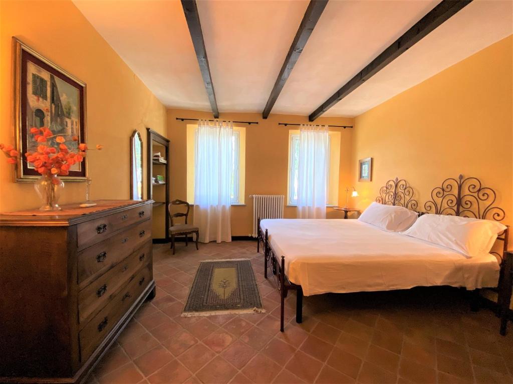 Posteľ alebo postele v izbe v ubytovaní B&B Tenuta Montegrande