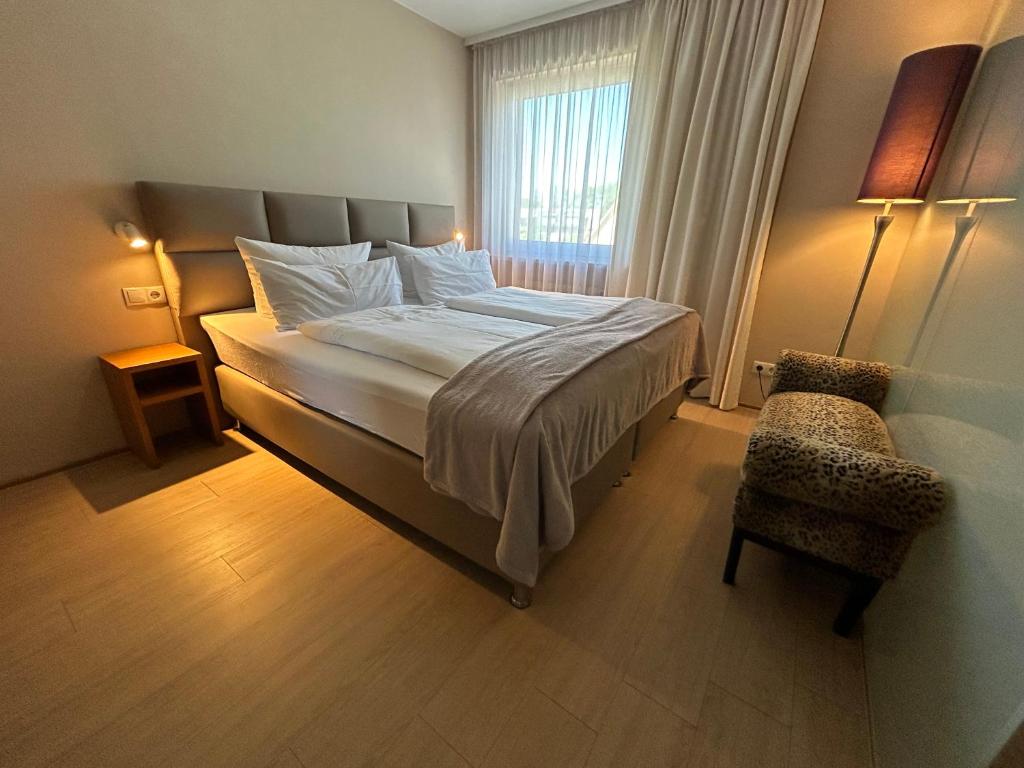 Postel nebo postele na pokoji v ubytování Maxhotel