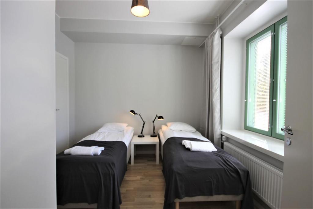 Ένα ή περισσότερα κρεβάτια σε δωμάτιο στο Forenom Serviced Apartments Kuopio