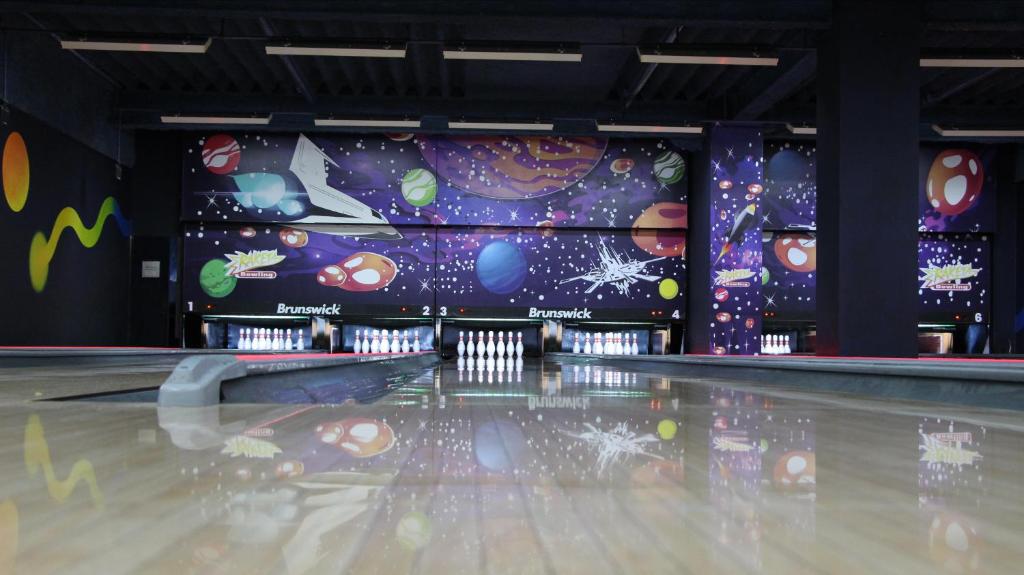 an empty bowling alley with a bowling ball at Penzion Raketa Bowling in Opava