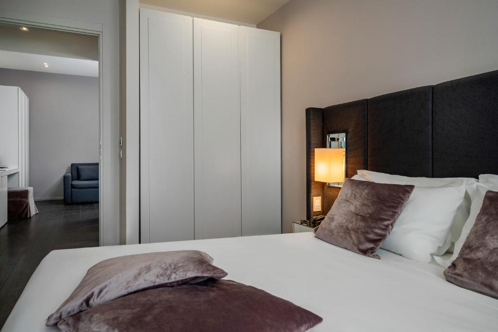Postel nebo postele na pokoji v ubytování Hotel Ines