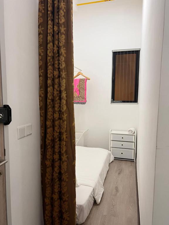 Postel nebo postele na pokoji v ubytování Damai Antara Homestay