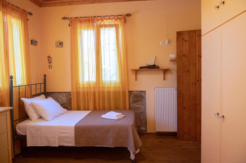Postel nebo postele na pokoji v ubytování ΑΝeΜΙ