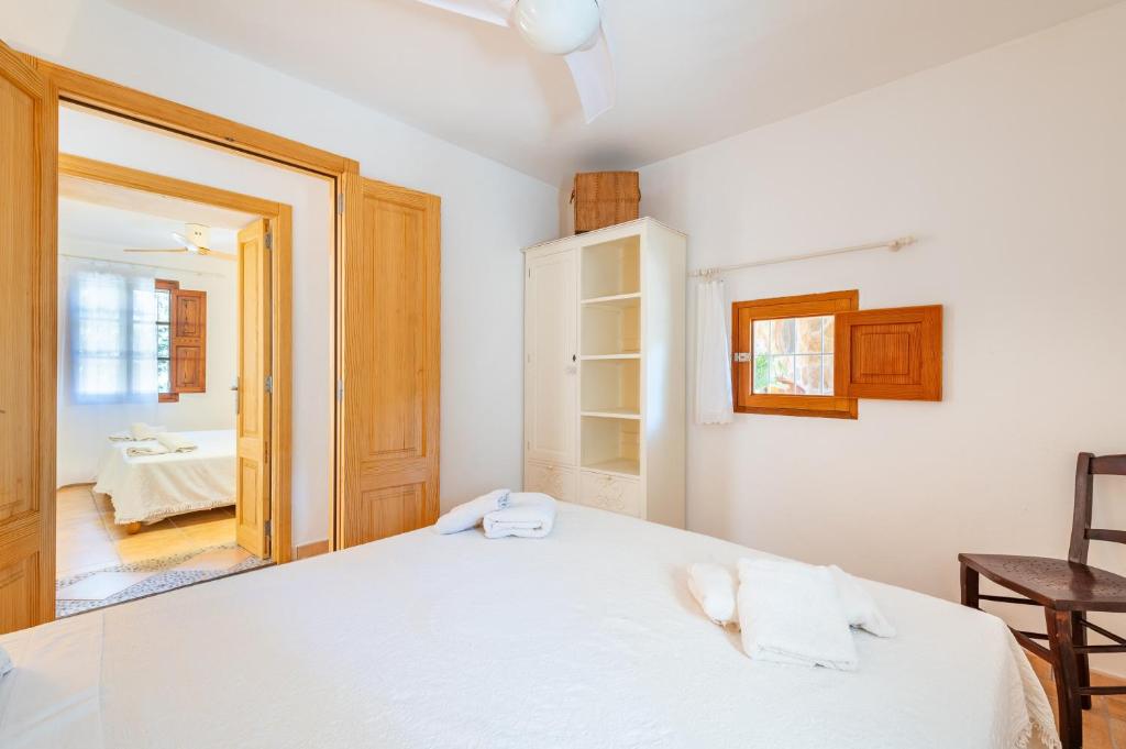 A bed or beds in a room at Marina Ses Covetes