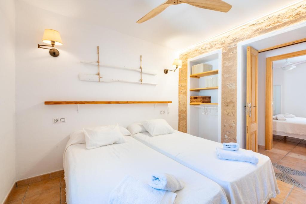 A bed or beds in a room at Marina Ses Covetes