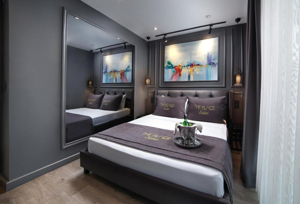 A bed or beds in a room at Ataşehir The Place Suites