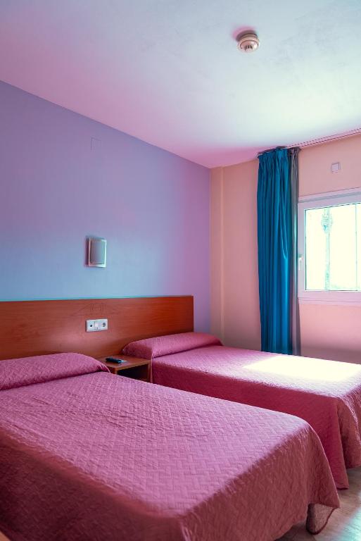 Postel nebo postele na pokoji v ubytování Hotelet elRetiro
