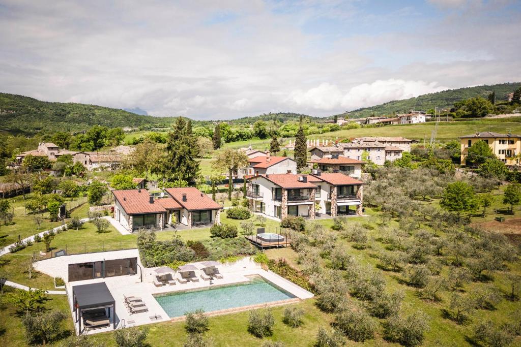 an aerial view of a house with a swimming pool at Cielo&Terra Resort in Costermano