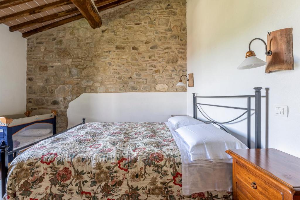 Postel nebo postele na pokoji v ubytování Podere Marcigliana