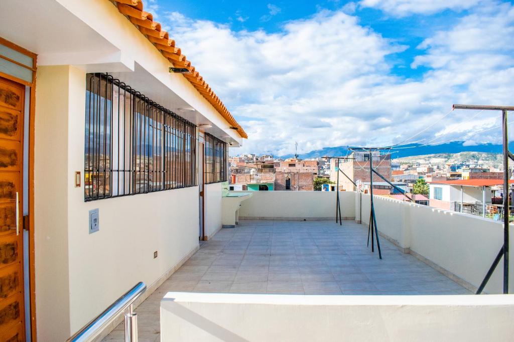 a balcony with a view of a city at Hostal Perlaschallay in Ayacucho