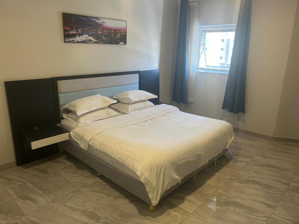 Postel nebo postele na pokoji v ubytování فندق سويت سبيريت الجوف