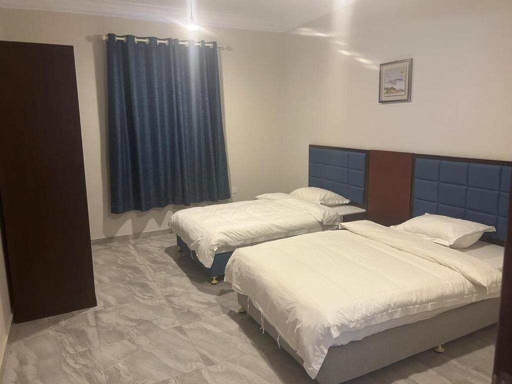 Postel nebo postele na pokoji v ubytování فندق سويت سبيريت الجوف