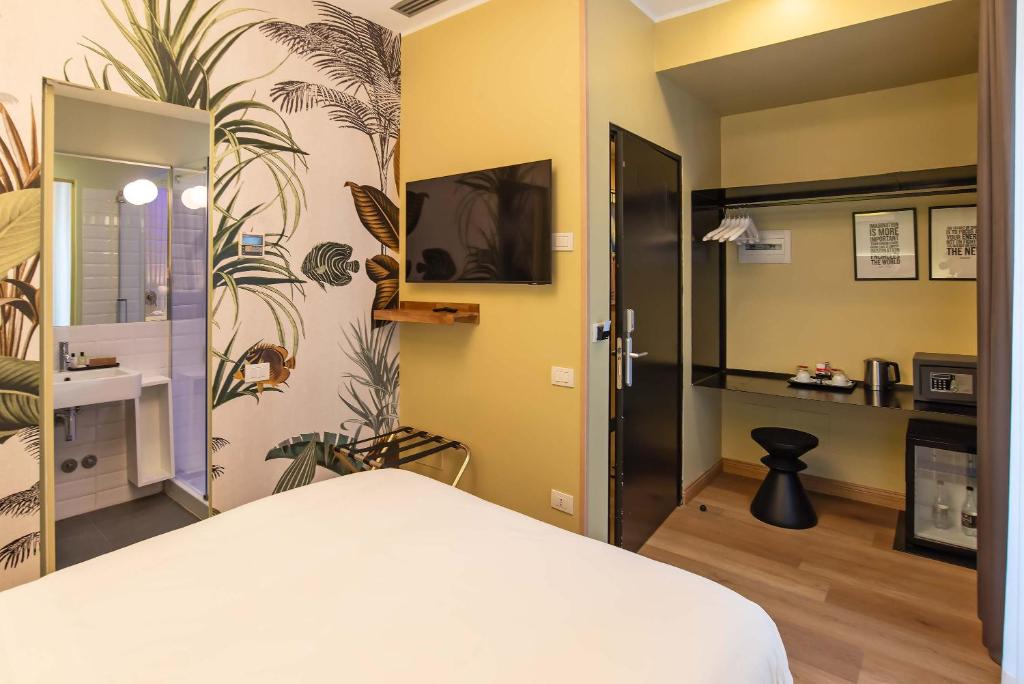 Postel nebo postele na pokoji v ubytování Hotel Elite