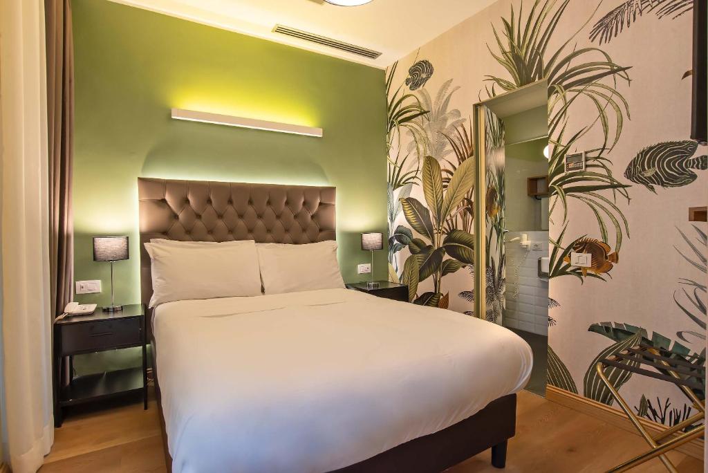 Postel nebo postele na pokoji v ubytování Hotel Elite