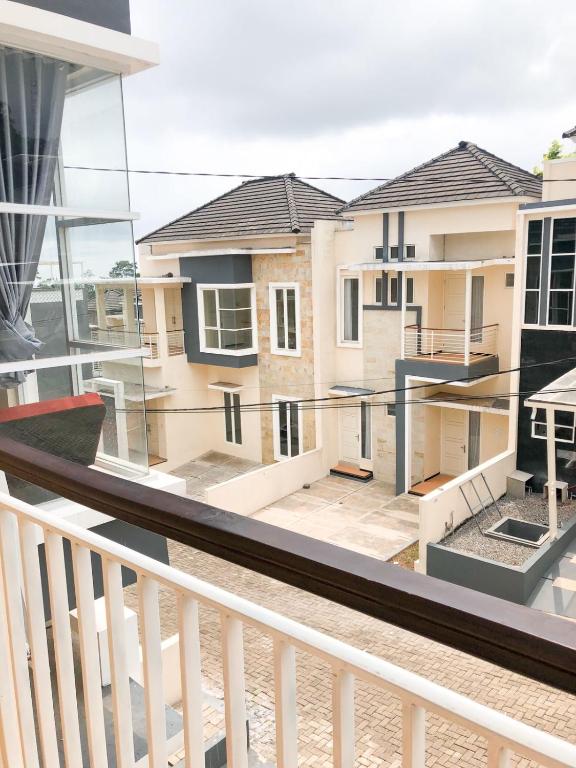 a balcony with a view of some buildings at Villa risky A11 in Tlekung