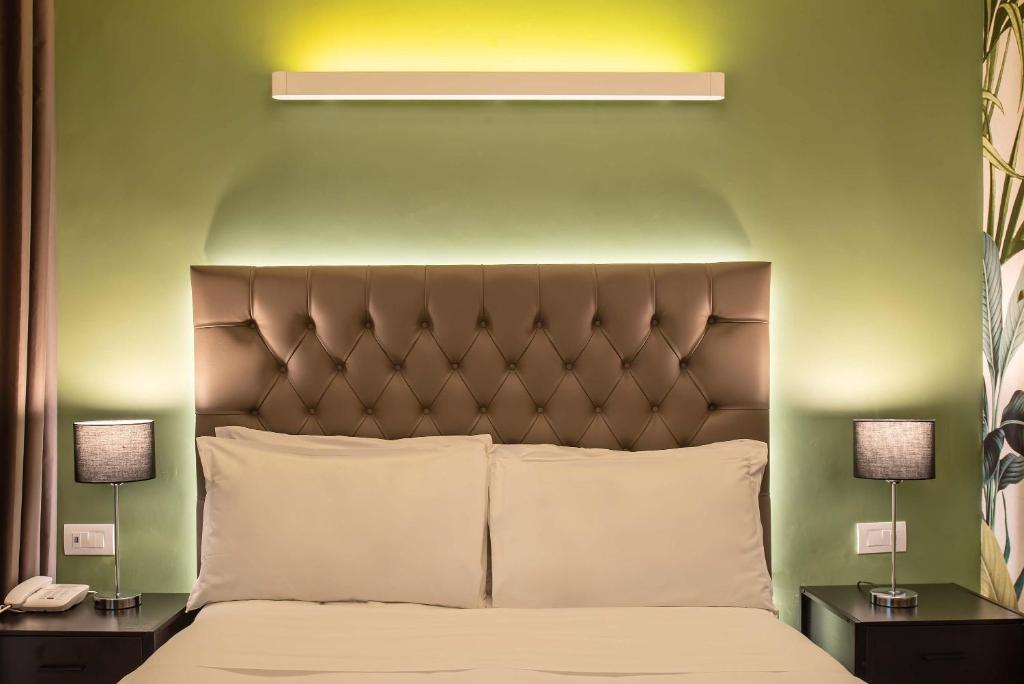 Postel nebo postele na pokoji v ubytování Hotel Elite