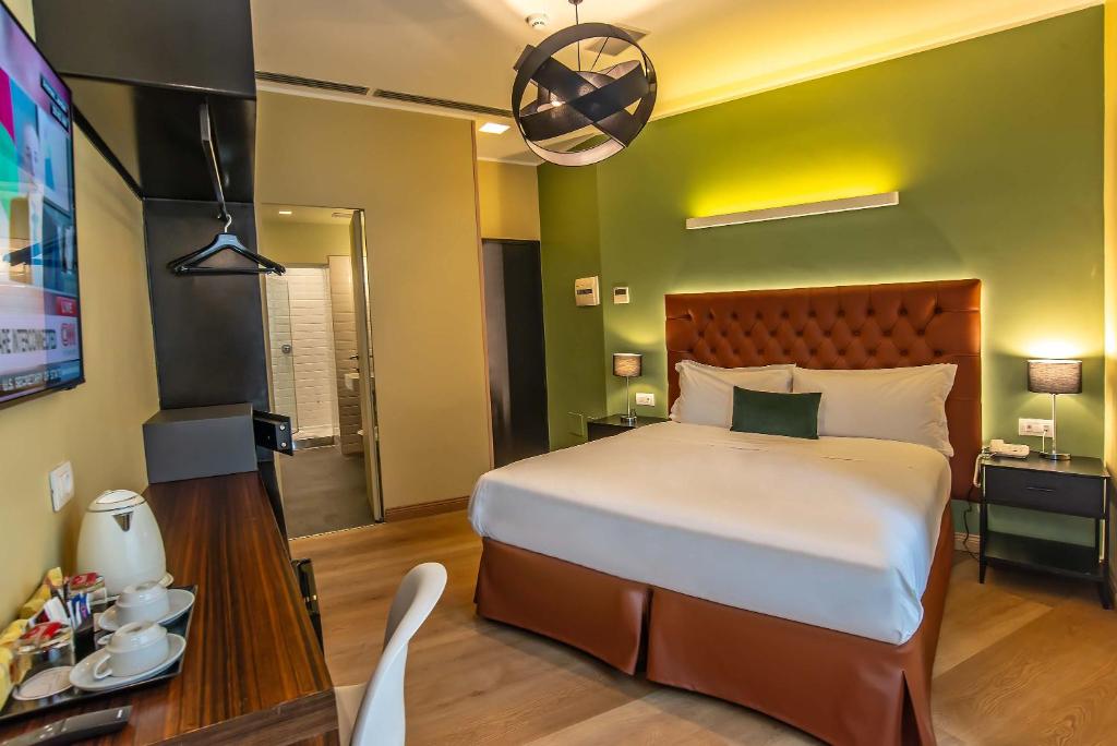 Postel nebo postele na pokoji v ubytování Hotel Elite