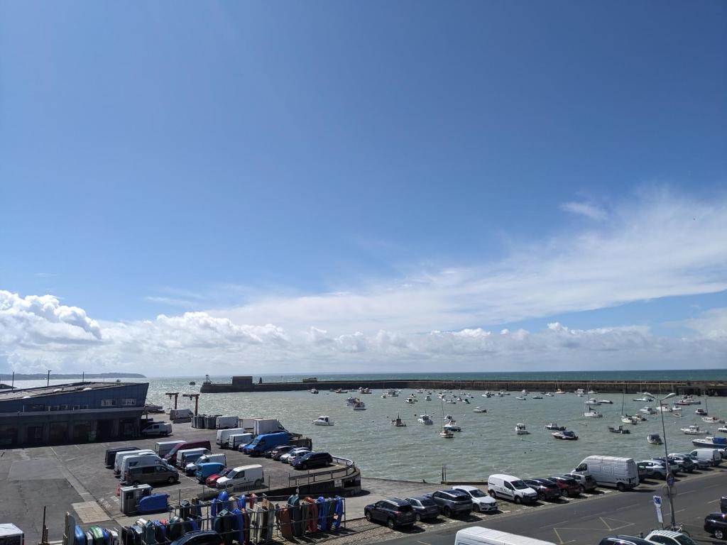 a group of boats in the water in a harbor at La Vigie sur le Port in Granville
