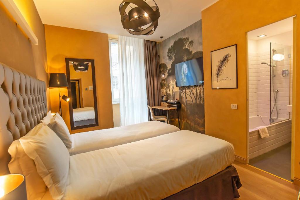 Postel nebo postele na pokoji v ubytování Hotel Elite