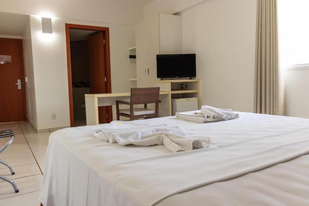 Cama ou camas em um quarto em Apartamento Le Jardin