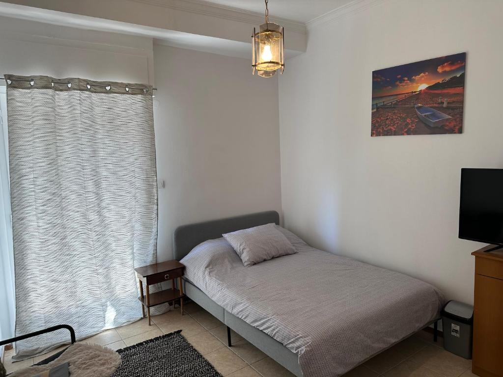 Ένα ή περισσότερα κρεβάτια σε δωμάτιο στο Delicious Studio