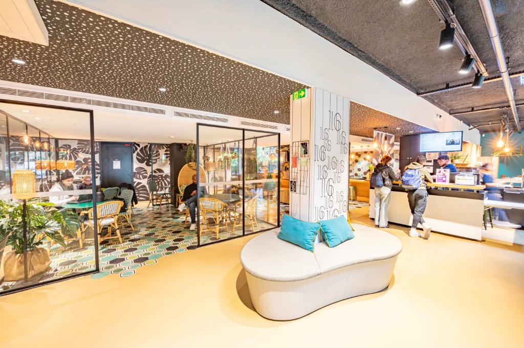a store with a chair in the middle of a room at ibis Styles Paris 16 Boulogne in Paris