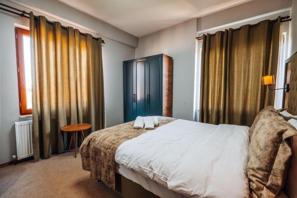 Postel nebo postele na pokoji v ubytování Mysia Olympos Hotel